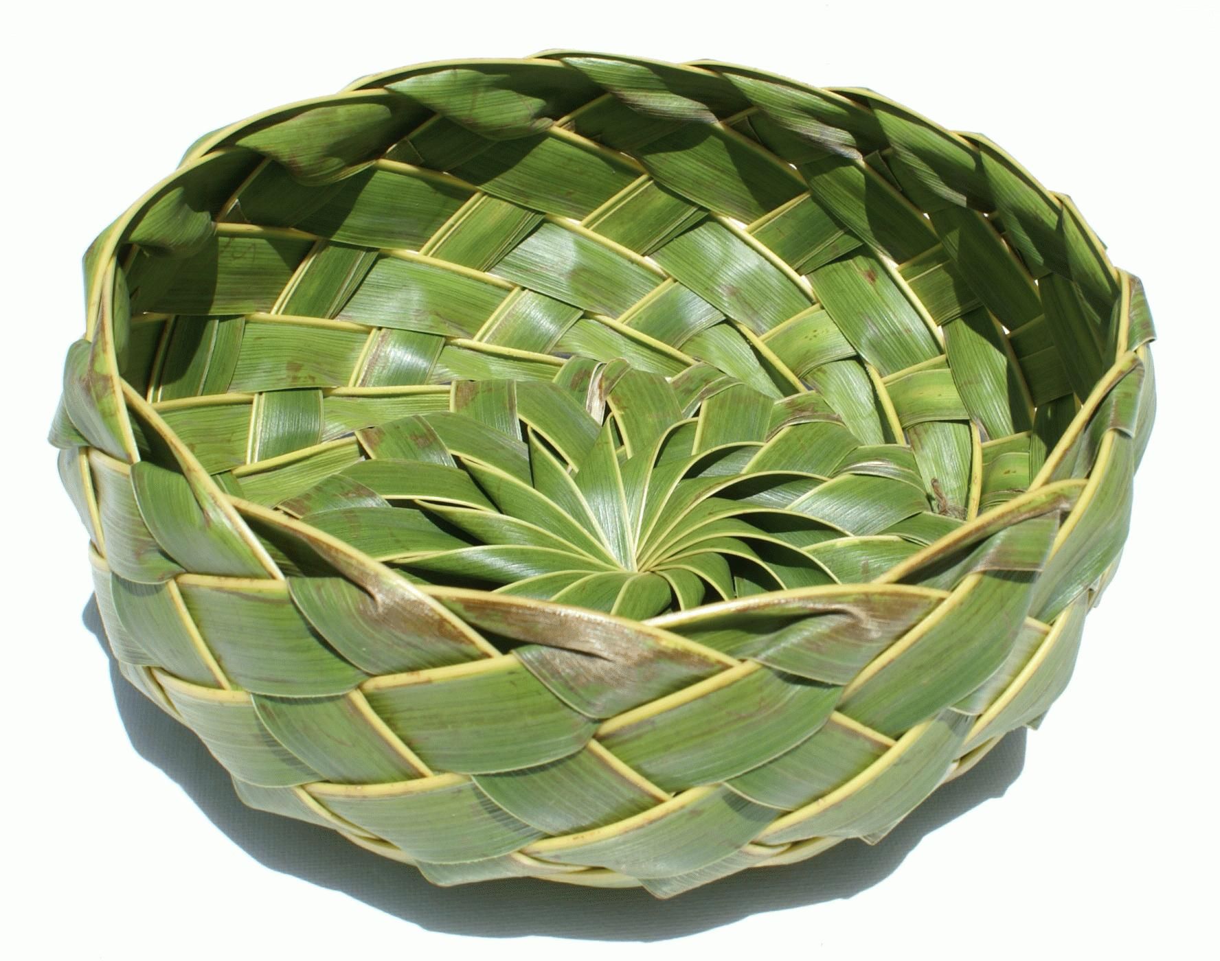 Weaving baskets with date palm leaves